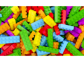 A pile of brightly coloured plastic building bricks