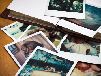 A stack of fading polaroid photographs