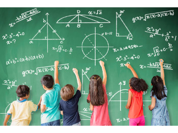 children solving math at blackboard