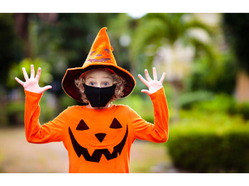 Child in a pumpkin Halloween costume