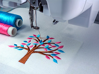 Digital Embroidery example of a tree with colourful leaves