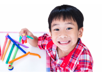 A child making a person with pipe cleaners.