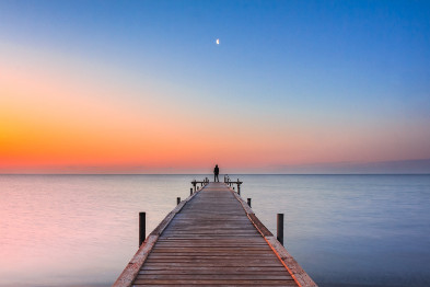 A dock looking and a sunrise