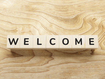 Welcome spelled out on wooden blocks.
