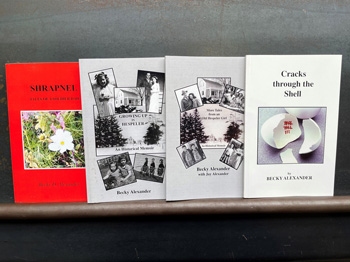 Four books on a shelf by author Becky Alexander.