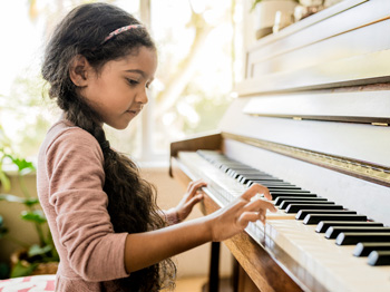 A child playing a piano.