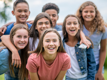 A group portrait of children standing together smiling.