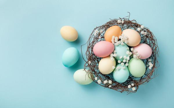 A basket full of colourful Easter eggs