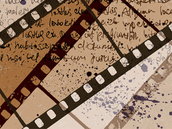 A photograph showing filmstrips overtop handwriting on a piece of paper.